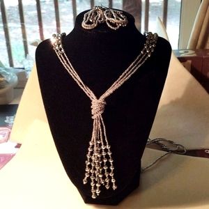 Silver necklace with silver tassel and matching earrings